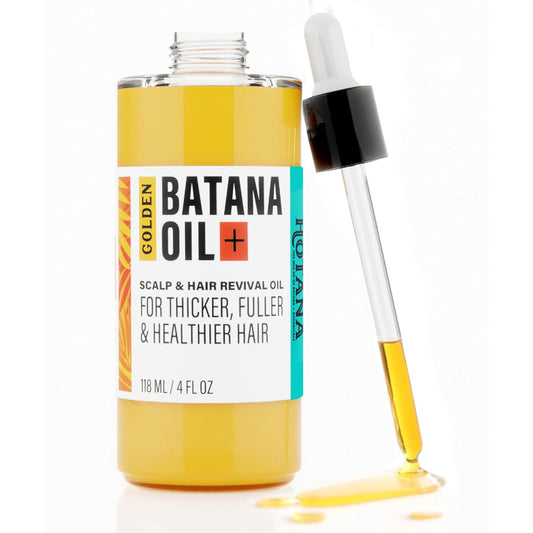 Batana Oil bottle with dropper on a white background