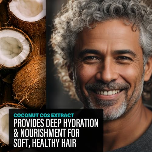 Man with gray hair and beard smiling next to coconuts and text about coconut CO2 extract for hair care.