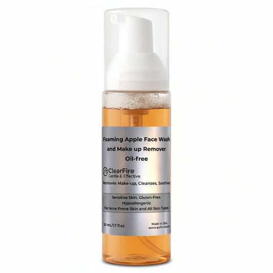 Foaming apple face wash and makeup remover bottle with white pump on a white background