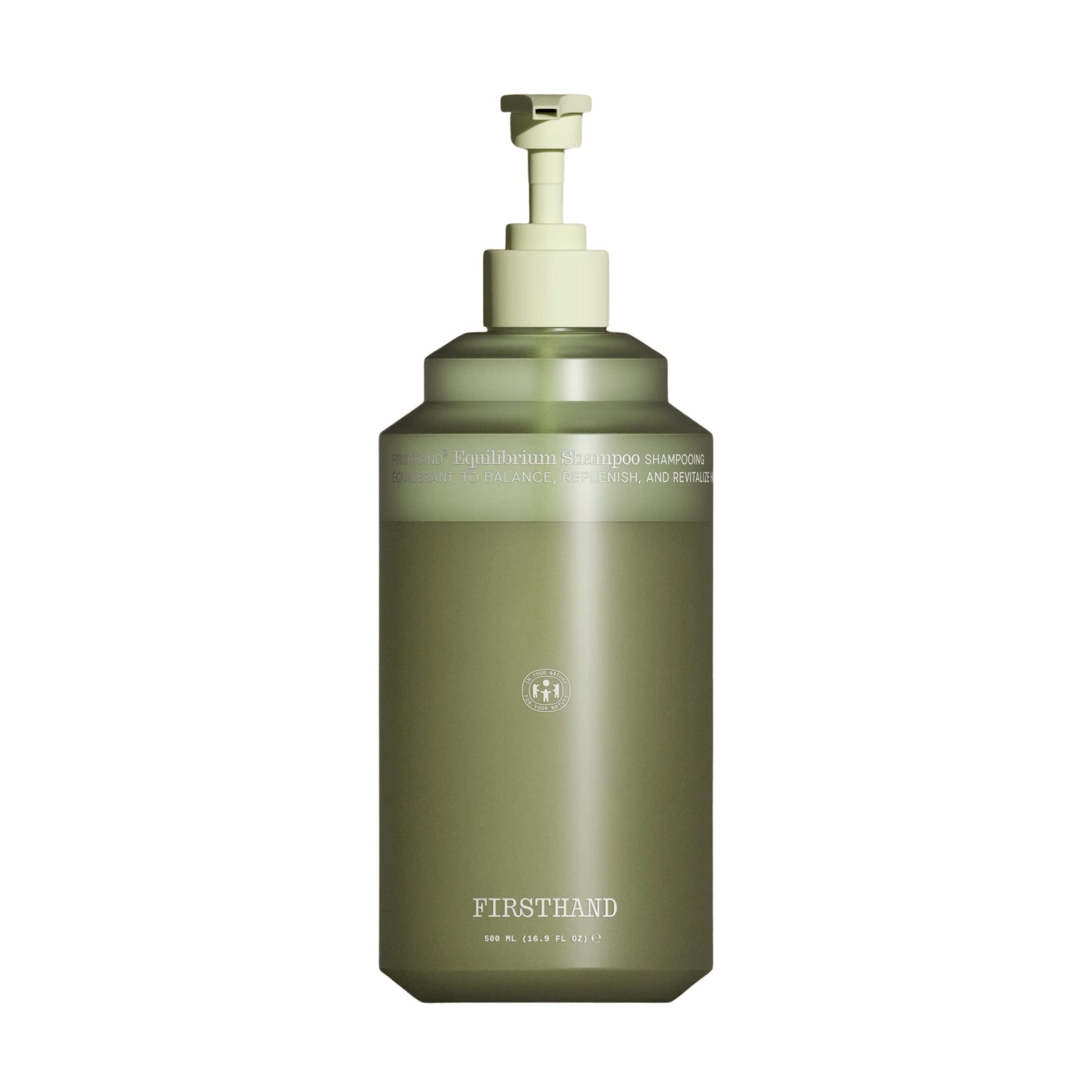 Green bottle with pump dispenser on a white background