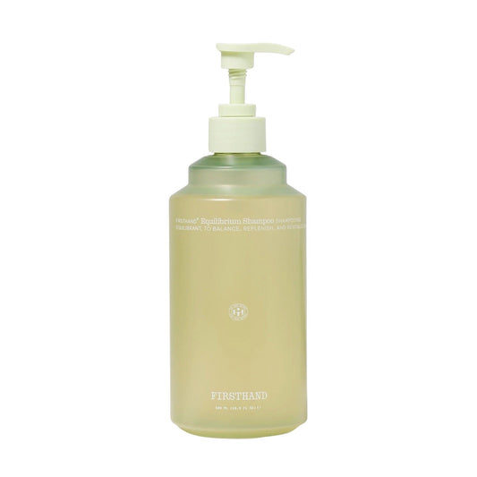 Beige bottle with pump on a white background