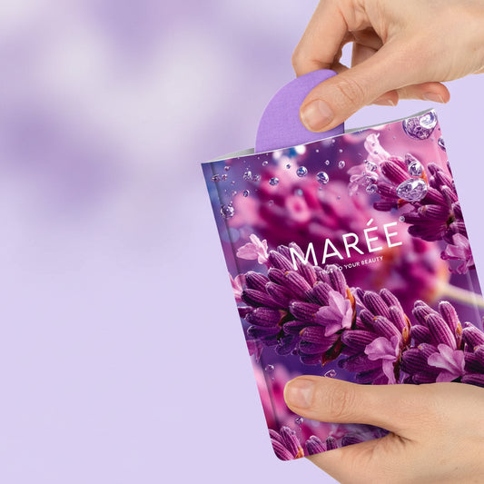 Product packaging with purple flowers and 'Maree' branding, held by a hand on a light purple background.