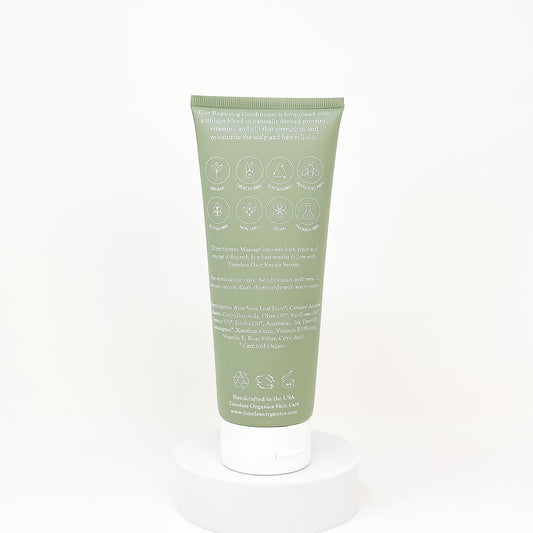 Green tube of cream with text and symbols on a white background
