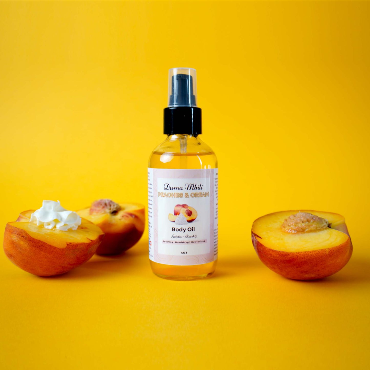 Body oil bottle with peach slices on a yellow background