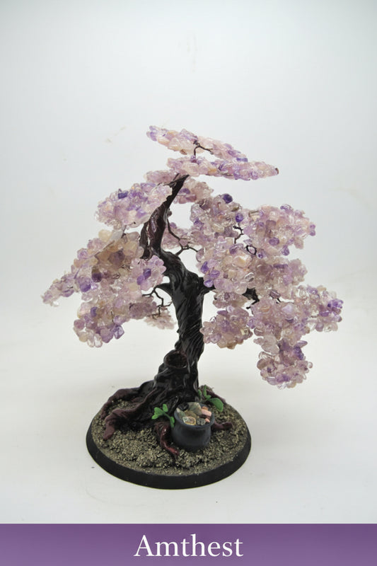 Decorative tree with purple stones on a white background
