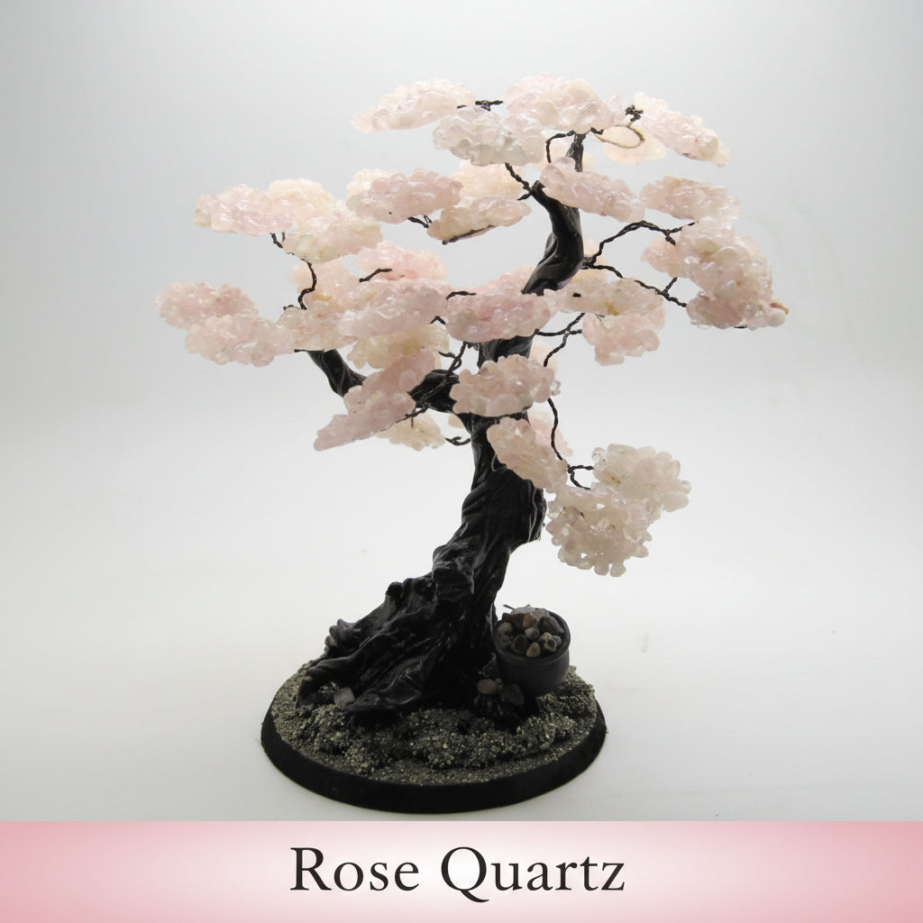 Decorative stone bonsai tree with pink stones on a white background