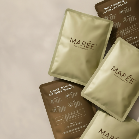 Several MARÉE chin lifting mask pouches arranged on a light beige background, with two cream-colored pouches in the foreground and three brown pouches behind them.